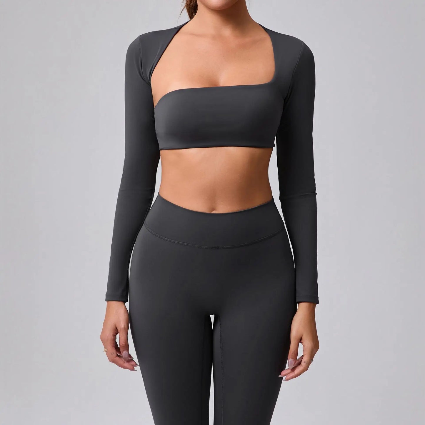 Women's sports crop top with square neckline, asymmetric long sleeve, and quick-drying fabric.